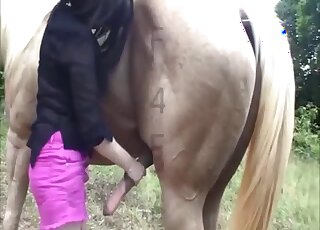 Masked angel is enjoying is sucking a hard horse dick